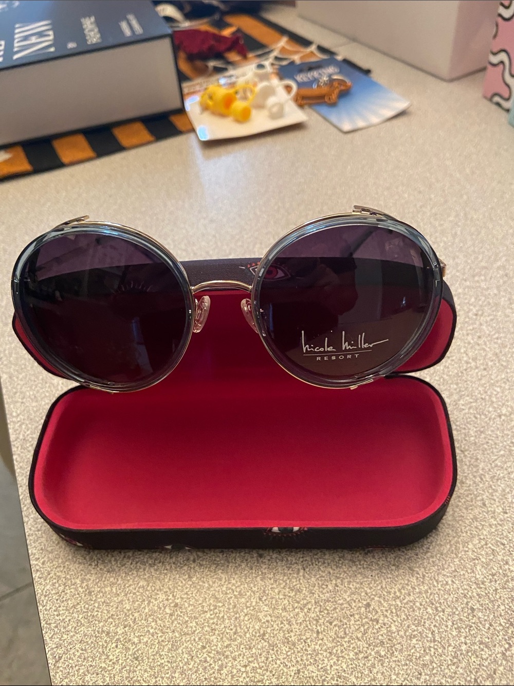 Nicole Miller Round Sunglasses in Black Frames with Dark Purple Lenses